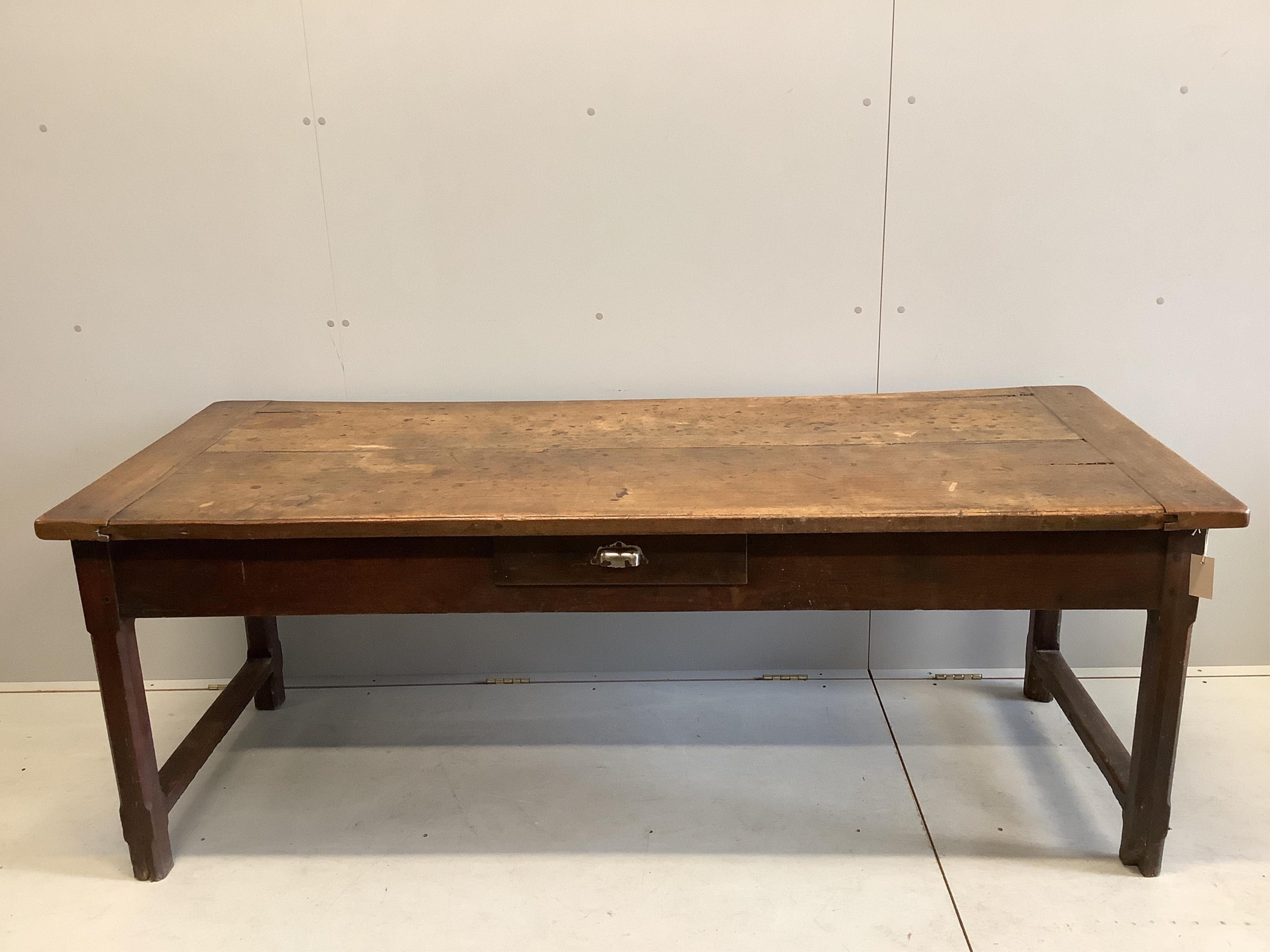A 19th century French fruitwood three drawer kitchen table with cleated twin plank top, width 193cm, depth 79cm, height 72cm. Condition - fair